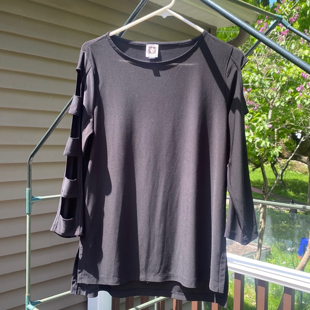 Black Anne Klein tunic top with cutout ladder/lattice sleeves. 
EUC Size M
